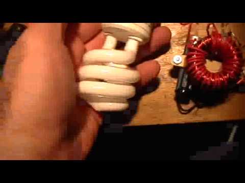 2N3055 - Dimly it flashes, less than 1.2 v input . Same circuit as before but with NE-2 removed and CFL wired in place. 13 watt 120 v unmodified CFL.