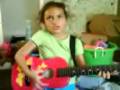Jaylene singing with guitar