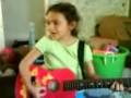 Jaylene singing with guitar
