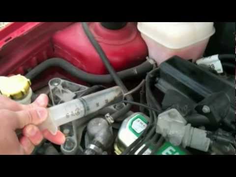 how to drain excess oil from a car