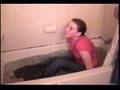 Sarah taking a bath in her clothes