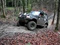 Christian driving up a short muddy slope in Boarp Christian driving up a short muddy slope in Boarp