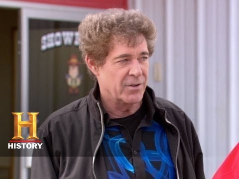 automobiles - TV's Barry Williams drops by the dealership to make an exotic trade for Mark's prized Cadillac.