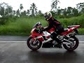 R1 girl rides iun the rain R1 girl rides iun the rain