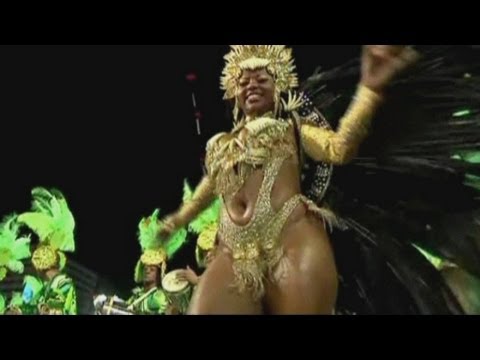 carnival - Scantily-clad beauty queens lead thousands of samba dancers through Rio de Janeiro's Sambadrome as the 15-day party reaches its final blow out. Report by Mat...