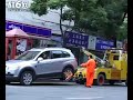 Hot Shanghai girl's Chevrolet Captiva left the Tow truck driver in despair............Poor ISUZU tow truck get towed by powerful Chevrolet SUV in Shanghai.