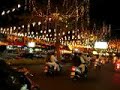 the saigon streets sparkled with lights as never before last christmas! this view is taken from ben's bike. we were trying to find a parking space to do our shopping at tax centre