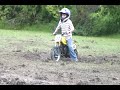 Chase riding his motorbike in the mud.