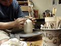 Throwing bottle on a kick wheel