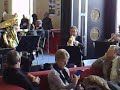 five players from the bournemouth symphony orchestra playing in the foyer before a concert, to help raise awareness of the players benevolent fund concert that is coming soon.