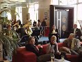 five players from the bournemouth symphony orchestra playing in the foyer before a concert, to help raise awareness of the players benevolent fund concert that is coming soon.