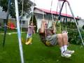 Pushing Grampa on the swing