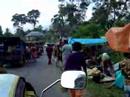 Riding through a village market in Sumatra