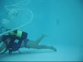 scuba john cleaning his pool