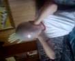 Sceptic having a rubber glove on his head