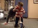 Alex plays on bike