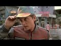 back to the future part 2 clip j.mp click to subscribe - marty (michael j. fox) surveys the hill valley of the future, marveling at of its technologies. tm & � universal (2011) cast: director: robert zemeckis movieclips youtube channel: j.mp join our facebook page: j.mp follow us on twitter: j.mp buy movie: amzn.to more movie clips: j.mp producer: bob gale, frank marshall, kathleen kennedy, neil canton, steve starkey, steven spielberg screenwriter: bob gale, robert zemeckis film description: things have barely settled from the excitement and resolve of the original back to the future, when in pops that crazy inventor dr. emmett brown (christopher lloyd) with news that in order to prevent a series of events that could ruin the mcfly name for posterity, marty mcfly (michael j. fox ) and his girlfriend are whisked into the future to the year 2015, where marty must tangle with a teen rogue named griff, who's obviously the descendant of biff, the first future film's bully. marty foils griff and his group when he jumps on an air-foil skateboard that flies him through town at rakish speeds with the loser bullies beaten again. marty gets a money-making brainstorm before hopping in the time-traveling delorean, and he purchases a sports almanac. he figures that back in 1985 he'll be able to place sure-fire bets using the published sports scores of the games that are yet to happen. unfortunately for marty, dr. brown disapproves of his betting scheme -- he feels too much messing with  ... 