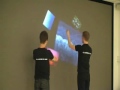 the project intends to develop new interaction methods for a multi-user human-computer system. the sponsor of this project wanted more effective, intuitive and cost-effective ways to work with petroleum technical data in their virtual reality program. the result of the project is a system where the user interacts with the computer on a screen with infrared pointers. the software tracks the pointers from images transferred from a high definition camera located behind the screen. the resulting system offers high performance and accuracy, though further improvements are necessary to make the system commercial attractive. however, this project shows that interaction methods only available on small scale, such as apple iphone's multi-touch, now can be realized on big screens.