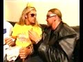 Edge and Christian play Triple H's music on a kazoo