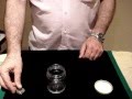 magical coin going through glass