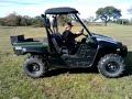 Alex driving a Rhino with Roscoe