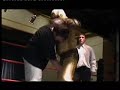 Moth man vs Adam Fate 23rd Auguest 2004 at the British Legion,Leigh A film By ...Tony Knox Edited BY John Scotland Project start of project to tranYoyeur show. Artist Tony Knox from the research materials collated and the various recordings to conceptualise the concept of the wrestler, or the hero, in contemporary society and place it within the surroundings of a gallery. Primarily, this was one of performance included with video and other reference sources researched, It develop in accordance with how the project evolved. The concluding art was presented during the Liverpool Biennial 2004 and part of the launch of transVoyeur. Knox trained with gargage professional Wrestling school in wigan for 4 months in preparshion for the match that was filmed Live.