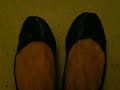 soft black ballet flats flexing