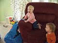 Triplets Playing with Cat
