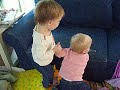 Triplets Playing with Cat