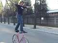 Standing on the Handlebar and Saddle of a Bike Standing on the Handlebar and Saddle of a Bike