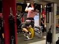 Girl doing pullups with 25kg (55 pounds) added wei