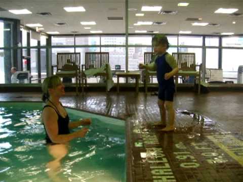 hizook - our boy jumping in the pool. He didn't like the water at first, but hey, a cute girl will get him in every time!