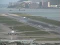 Cathay Pacific Boeing 777 checkerboard Hong Kong crosswind