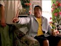 three young polynesian men and a woman sitting in a lounge room. One of them picks up a china vase and throws it to his mate across the room who wants it. his mate ducks out of the way. Smash! A woman, the owner of the vase, enters the room. 