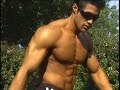 Bodybuilder Jaime Davila posing at a park 2 Bodybuilder Jaime Davila posing at a park 2