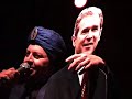 gerald casale, backed by the spudboys at the total devotional at beachland ballroom in cleveland on 8-25-07, as jihad jerry, interacts musically with an effigy of president george w. bush.