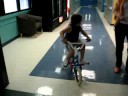 Danny on a 2 wheel bike with training wheels