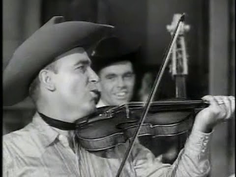 Will's - Bob Wills shows his master showmanship as both bandleader and musician in this short known as Fiddlin' Man. Backing the king of western swing, the gum-chewin...