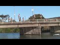 Kiwi barefooters bridge jumping.