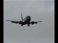 aircraft landing on runway 14 in the rain