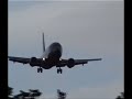 aircraft landing on runway 14 in the rain
