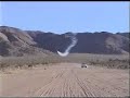 Grumman F6F Wildcat races old Jeep across the desert.