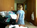 Little girl reading a book upside down