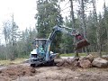 backhoe loader levling and moving some stone.mp4