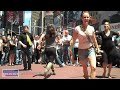 Watch a fight break into song as almost 50 performers suddenly break out to 