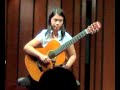 Iqui plays the classical guitar