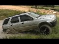 Isuzu going through mud pit