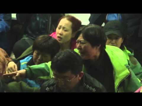 Raw: Angry Relatives Confront SKorea Officials