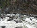 Expert White Water Warehouse boatman maneuvers through the infamous boulder garden at Blossom Bar rapids on Oregon's Rogue River. www.whitewaterwarehouse.com
