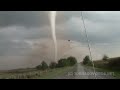 tornadovideos.net storm chasers Reed Timmer and Joel Taylor shot this INSANE video of a violent tornado from within 50 yards!!! We had to back up at the last second, and my cell phone fell out on the road and was taken away by the tornado!!